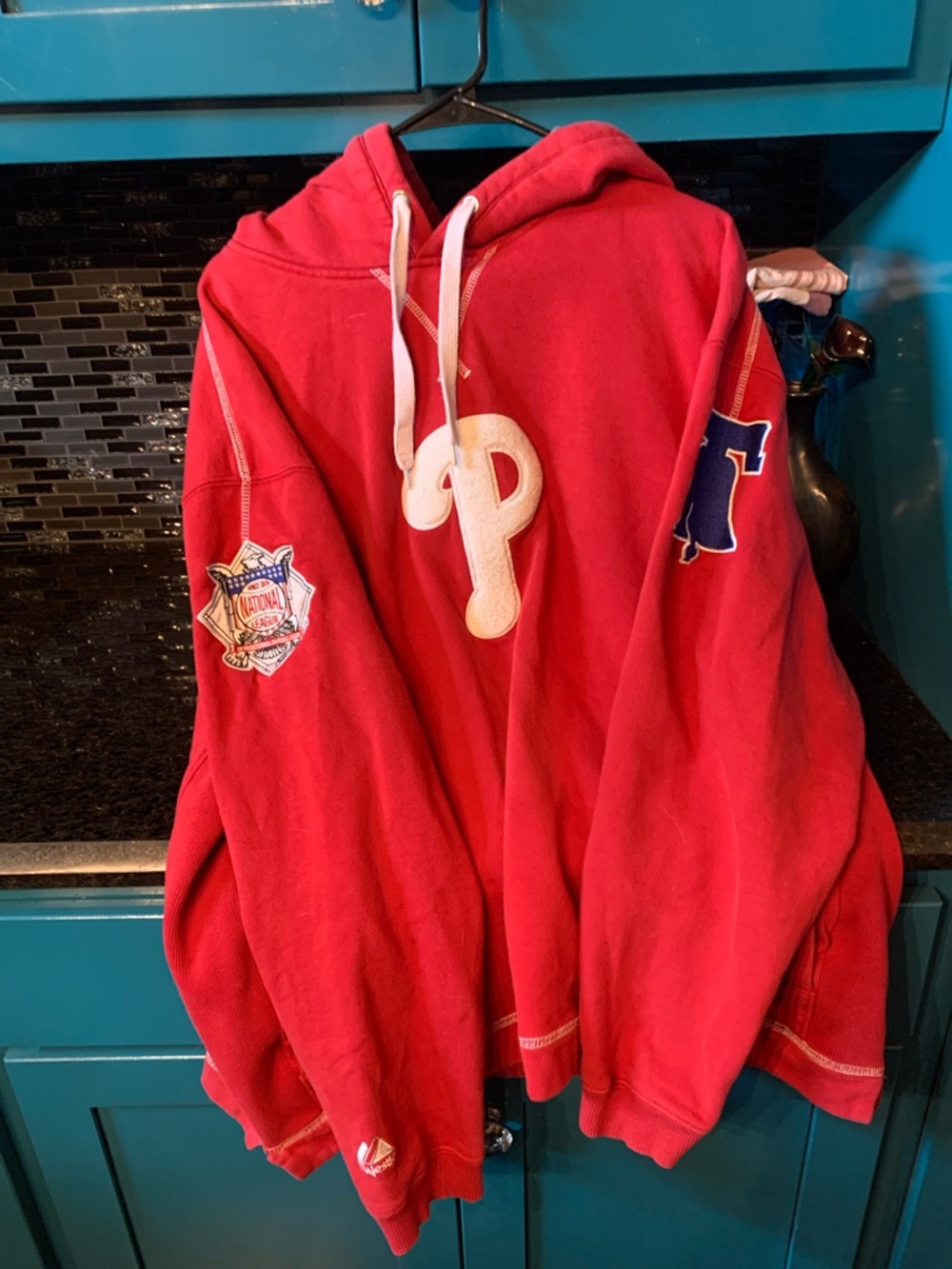 Red Hoodie with Embroidered P with patches  on each sleeve.